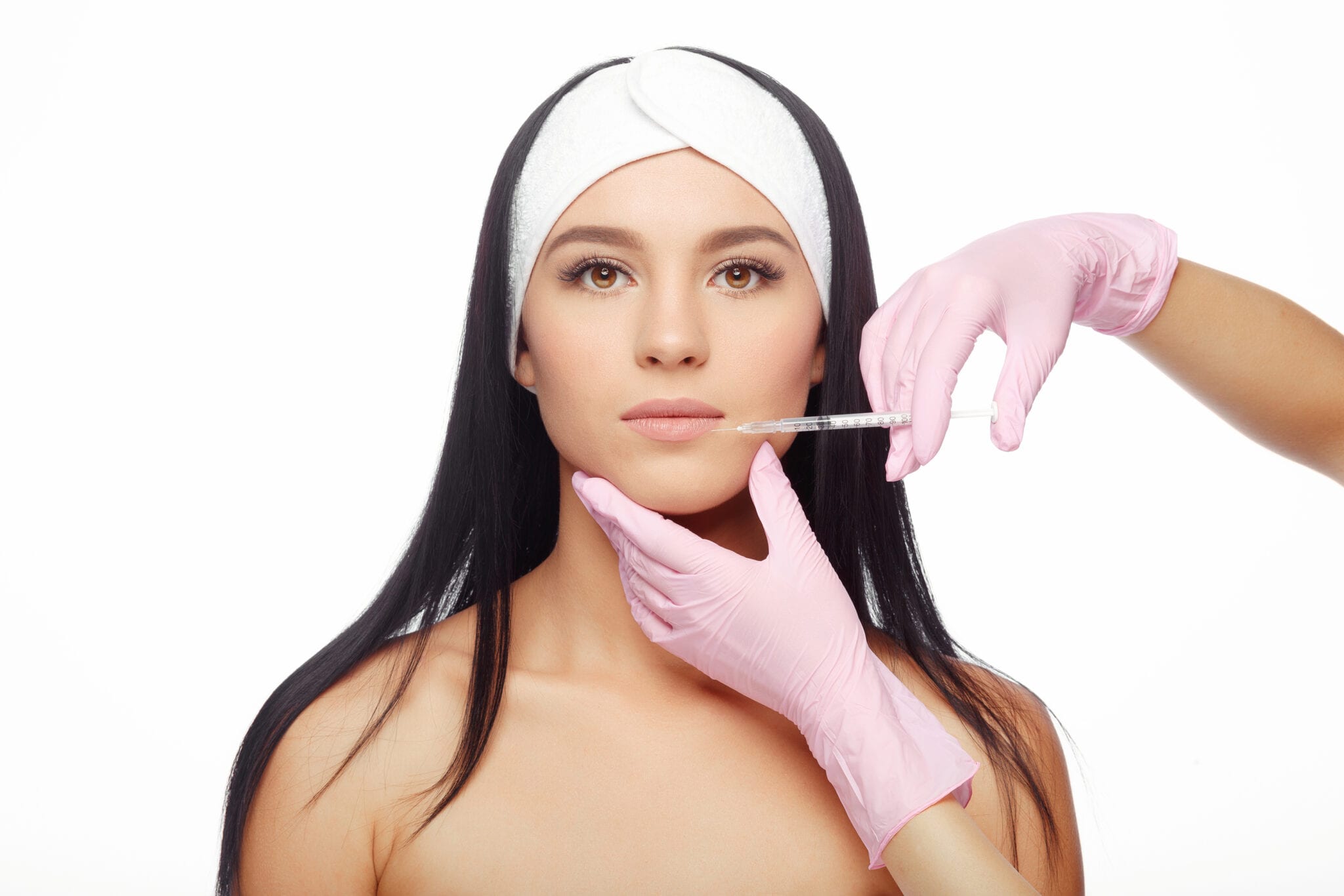 Brunette Receiving Lip Injection By Pink Gloved Hands