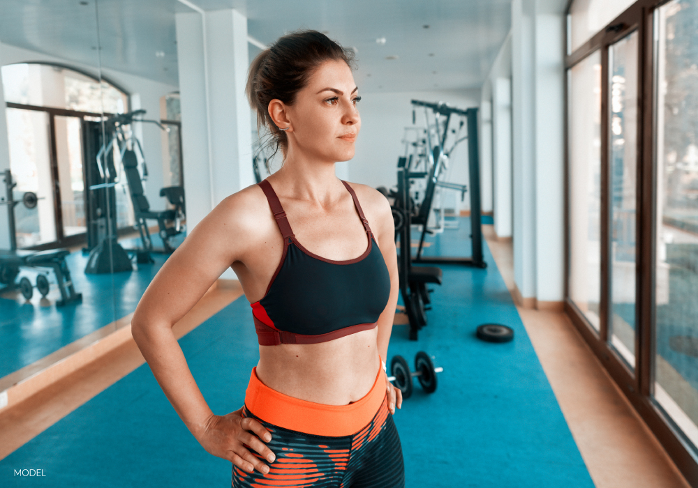 Woman Looking Out the Gym Window