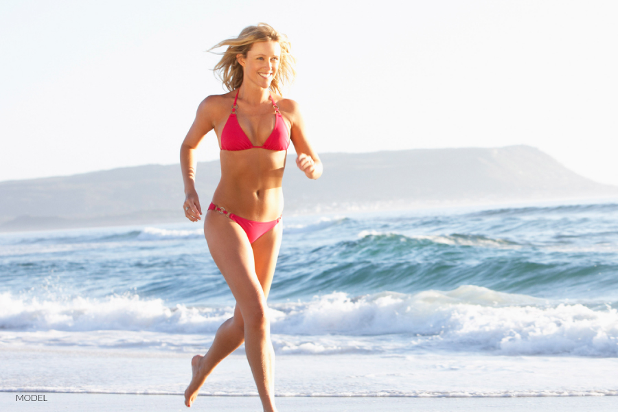 Woman Running on the Beach