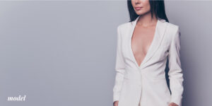 Woman With Reduced Breast Size in White Suit Jacket